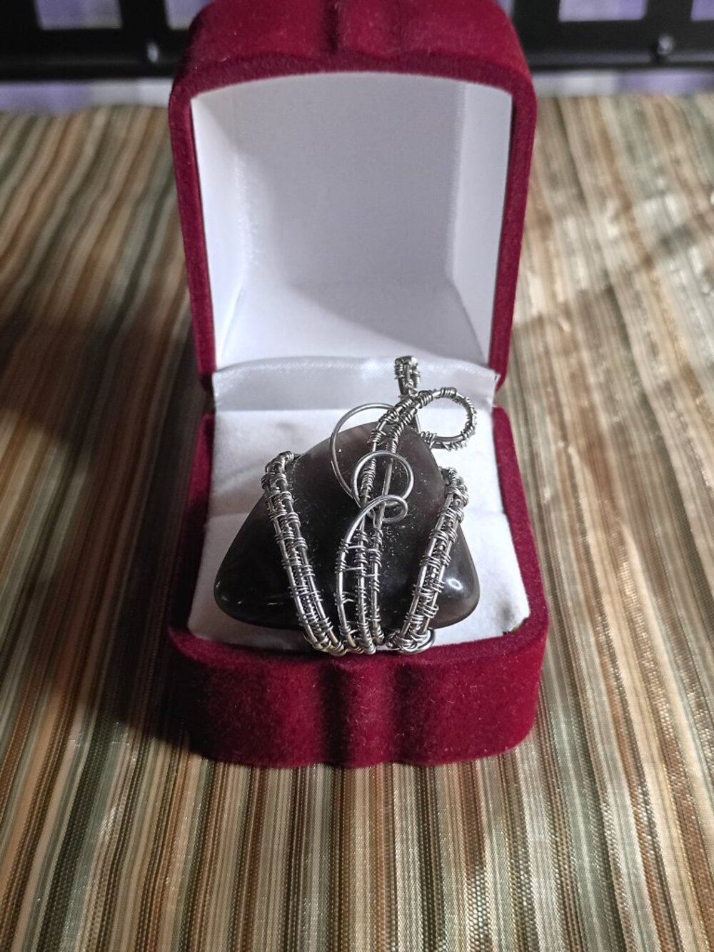 hand wrapped natural black onyx pendant
